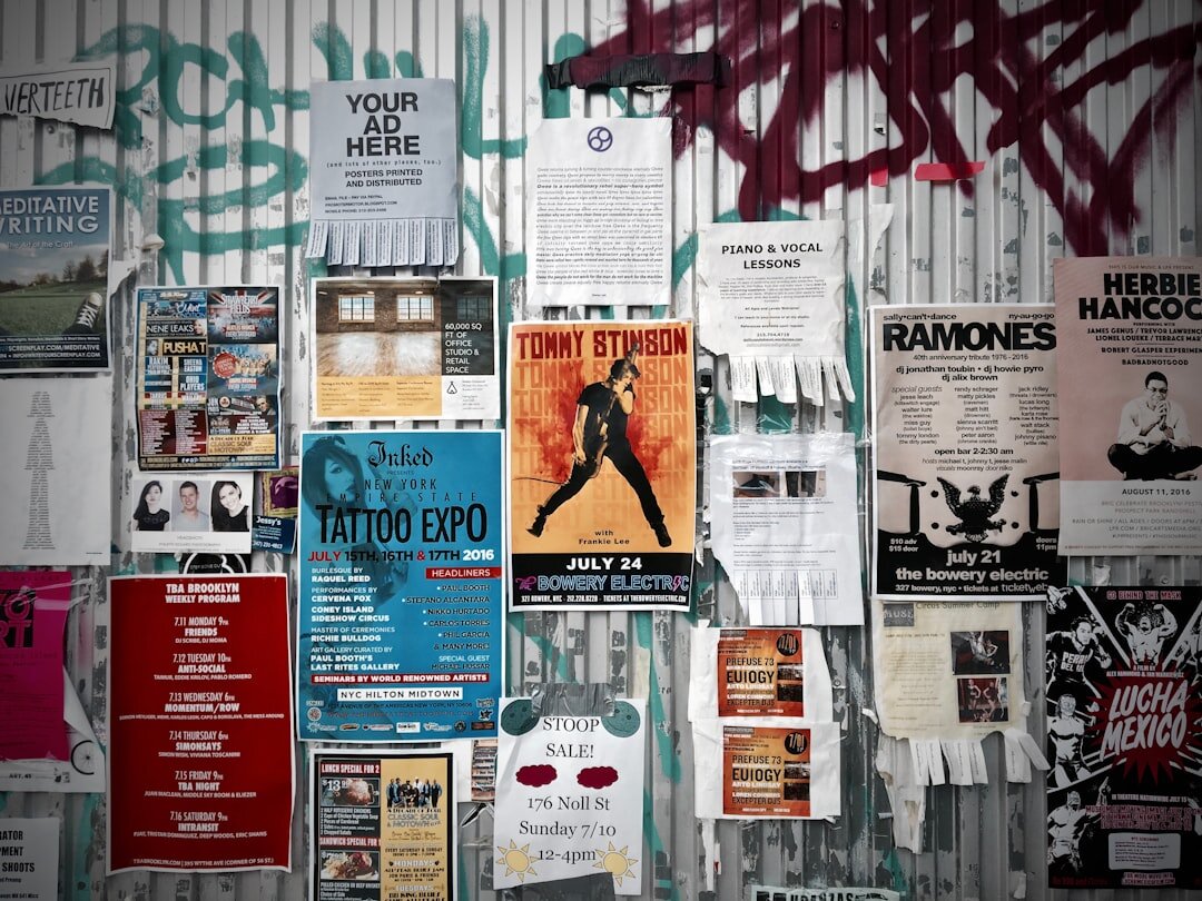 Wall covered with vintage advertising posters and print campaign clippings